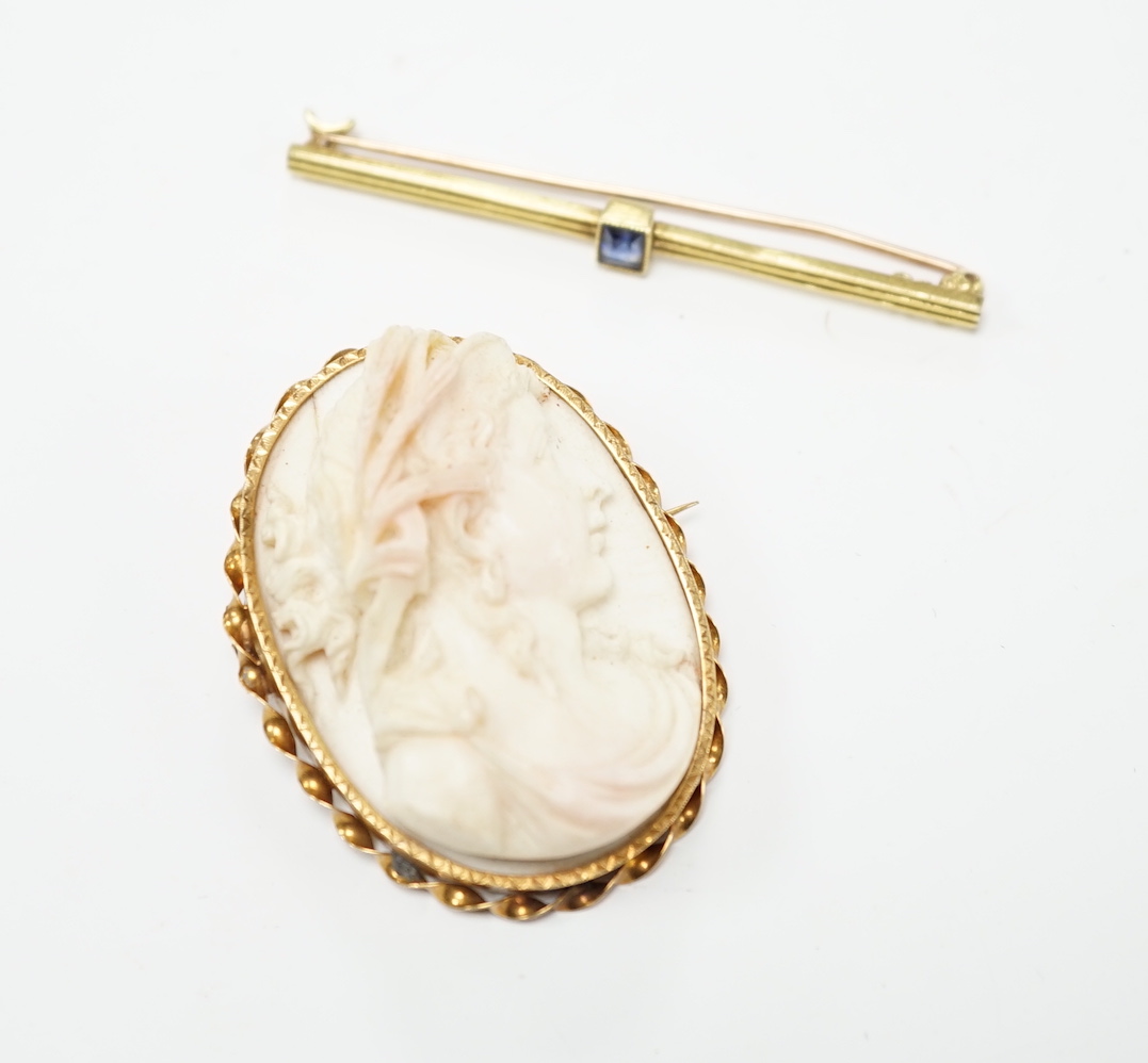 A yellow metal mounted composition cameo set oval brooch, 46mm, together with a yellow metal and gem set bar brooch.